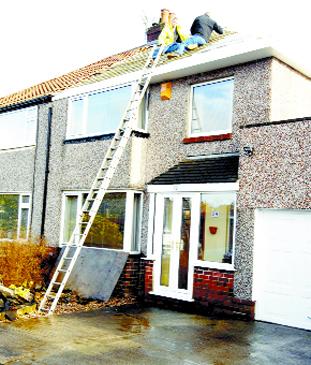 Man dies after falling from roof of house