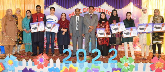 President of Anglo-Arabic Old Boys Association awards laptop to successful candidates