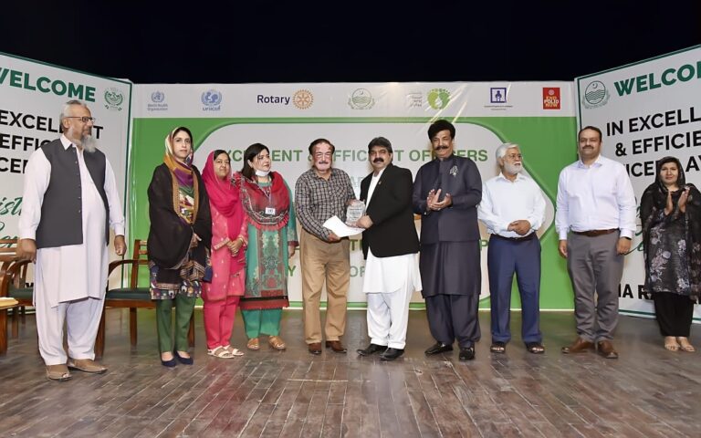 A certificate distribution ceremony by Rotary Club Rawalpindi and District Health Authority Rawalpindi